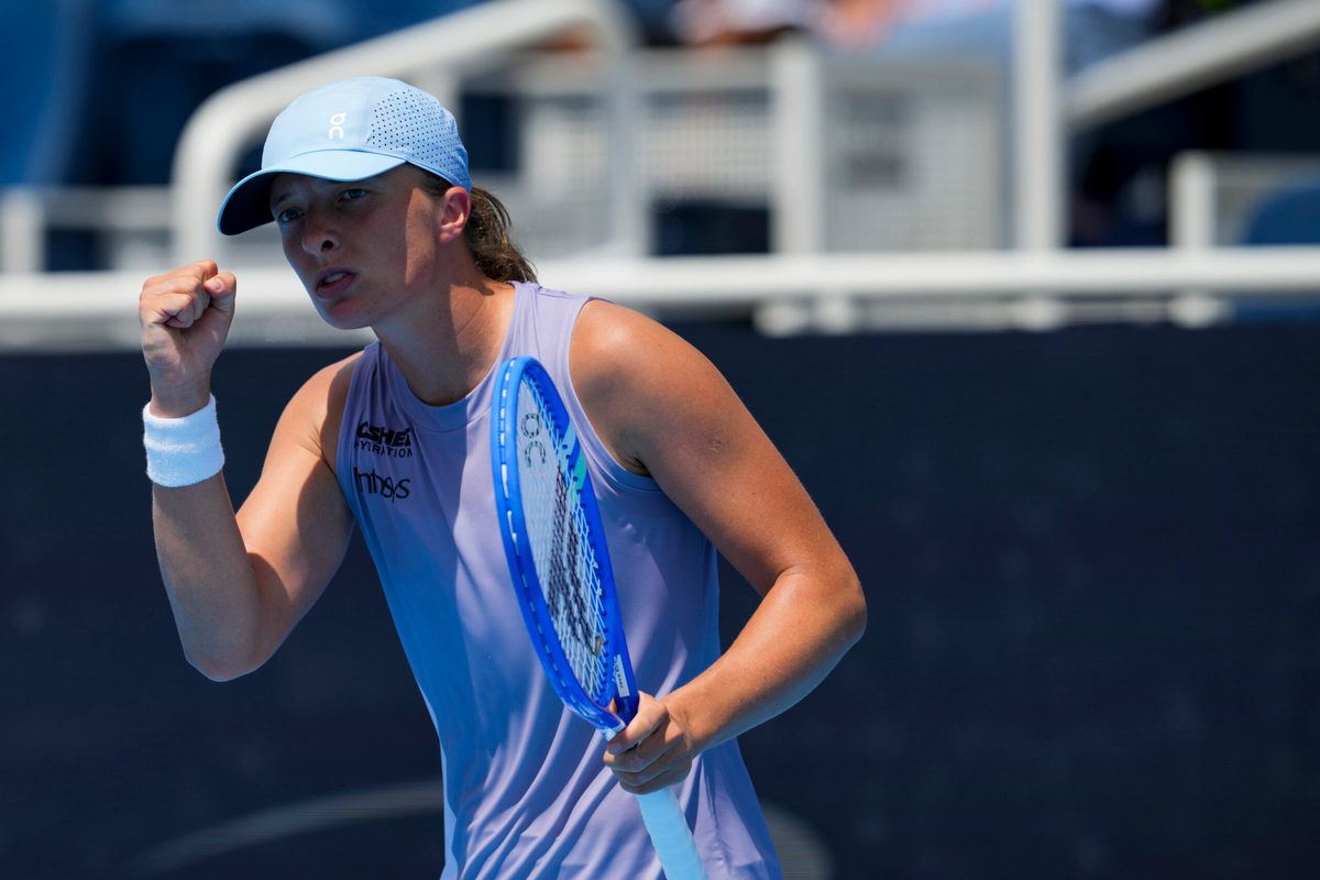 Aug 17, 2025; Cincinnati, OH, USA;  Iga Swiatek (POL) reacts after returning a shot against Elena Rybakina (KAZ) during the Cincinnati Open at the Lindner Family Tennis Center. Mandatory Credit: Aaron Doster-Imagn Images