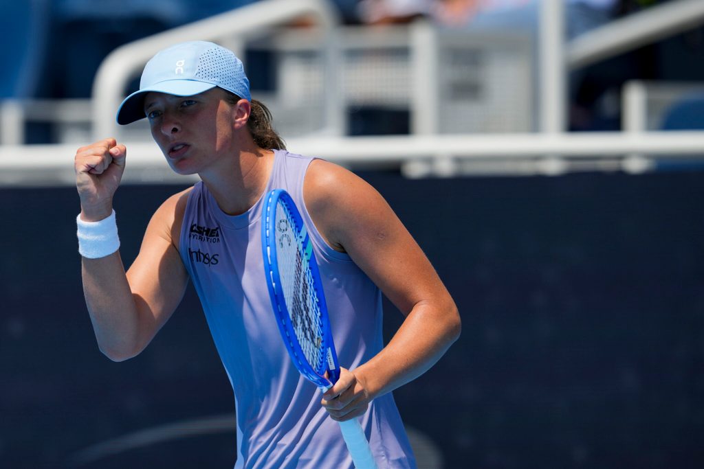 Aug 17, 2025; Cincinnati, OH, USA; Iga Swiatek (POL) reacts after returning a shot against Elena Rybakina (KAZ) during the Cincinnati Open at the Lindner Family Tennis Center. Mandatory Credit: Aaron Doster-Imagn Images