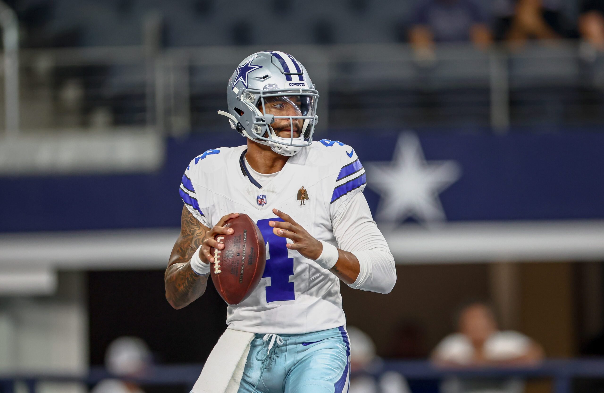 Aug 16, 2025; Arlington, Texas, USA; Dallas Cowboys quarterback Dak Prescott (4) warms up before the game against the Baltimore Ravens at AT&T Stadium. Mandatory Credit: Kevin Jairaj-Imagn Images