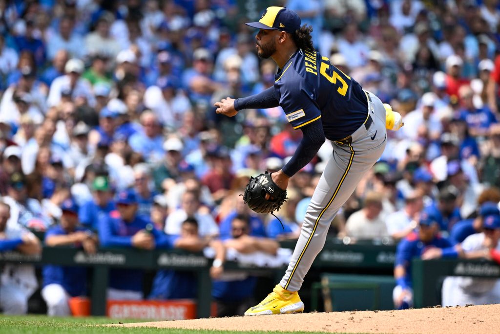 Aug 18, 2025; Chicago, Illinois, USA; Milwaukee Brewers pitcher Freddy Peralta (51) delivers during the second inning against the Chicago Cubs at Wrigley Field. Mandatory Credit: Matt Marton-Imagn Images