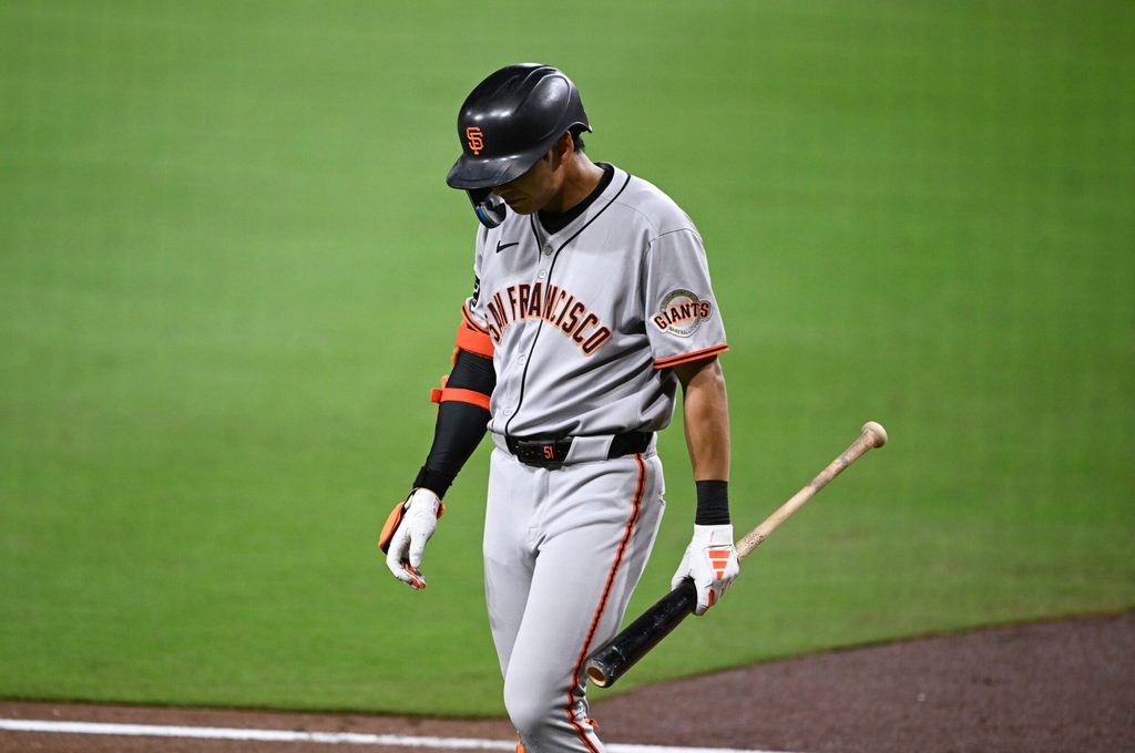 Aug 20, 2025; San Diego, California, USA; San Francisco Giants center fielder Jung Hoo Lee (51) walks back to the dugout after striking out during the seventh inning against the San Diego Padres at Petco Park. Mandatory Credit: Denis Poroy-Imagn Images