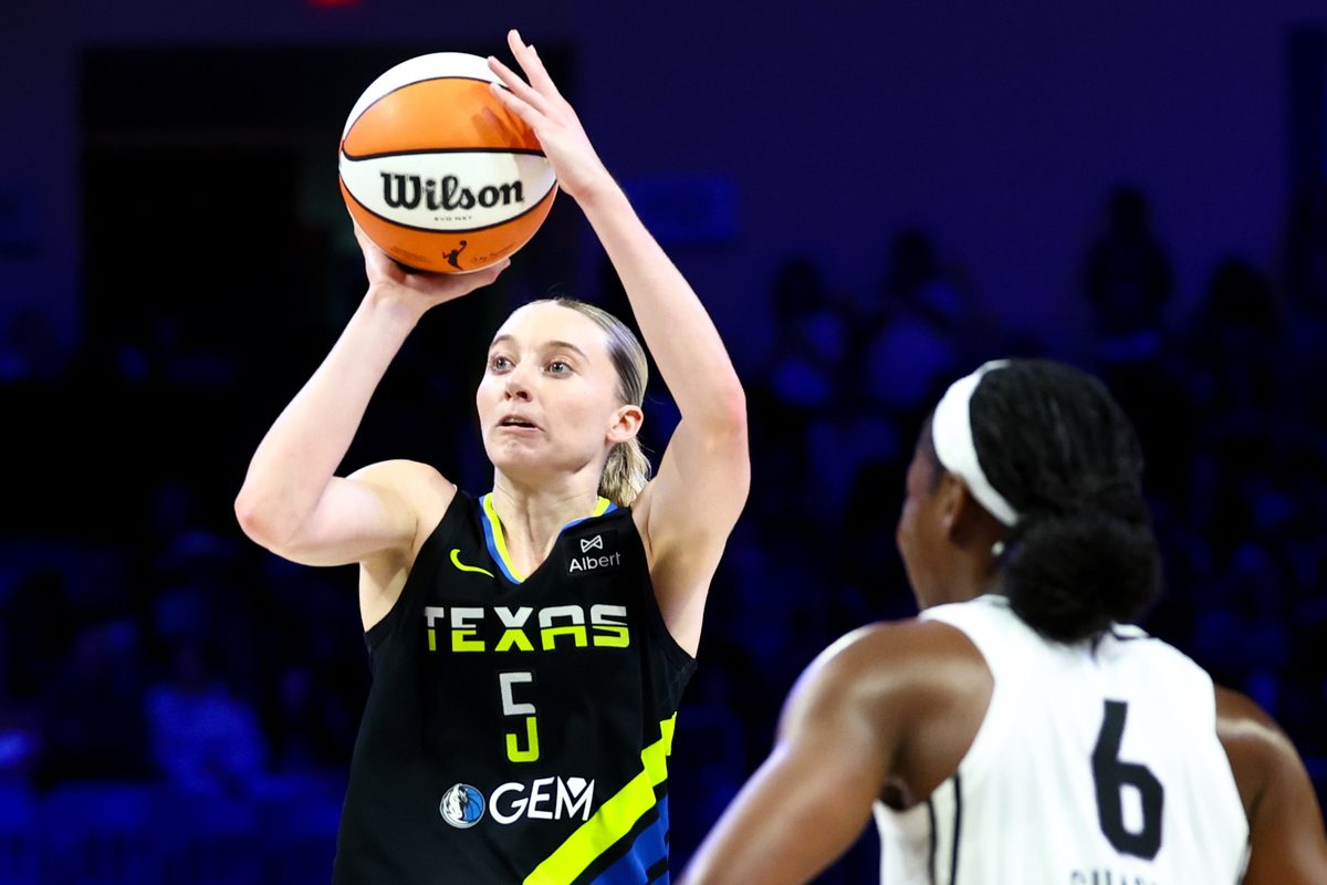 Aug 24, 2025; Arlington, Texas, USA; Dallas Wings guard Paige Bueckers (5) shoots over Golden State Valkyries guard Kaila Charles (6) during the second half at College Park Center. Mandatory Credit: Kevin Jairaj-Imagn Images