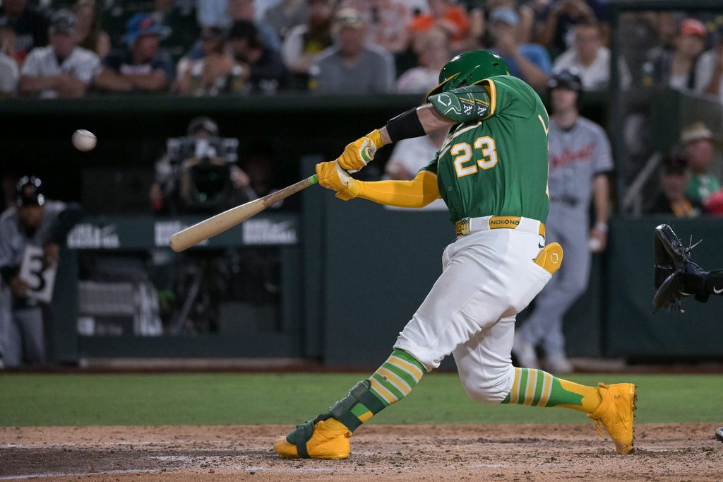 Aug 25, 2025; West Sacramento, California, USA; Athletics catcher Shea Langeliers (23) hits a grand slam against the Detroit Tigers during the seventh inning at Sutter Health Park. Mandatory Credit: Ed Szczepanski-Imagn Images