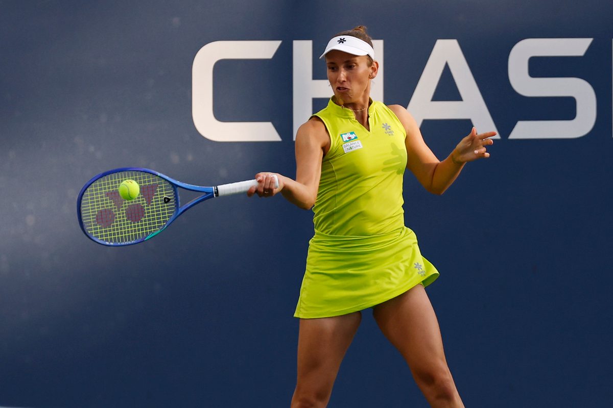 Aug 27, 2025; Flushing, NY, USA; Elise Mertens (BEL) hits a forehand against Lulu Sun (NZL) (not pictured) on day four of the 2025 US Open tennis tournament at Billie Jean King USTA National Tennis Center. Mandatory Credit: Geoff Burke-Imagn Images