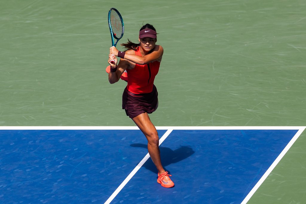 Aug 29, 2025; Flushing, NY, USA; Emma Raducanu of United Kingdom in action against Elena Rybakina of Kazakhstan in the third round of the womenís singles at the US Open at Louis Armstrong Stadium in Billie Jean King National Tennis Center. Mandatory Credit: Mike Frey-Imagn Images