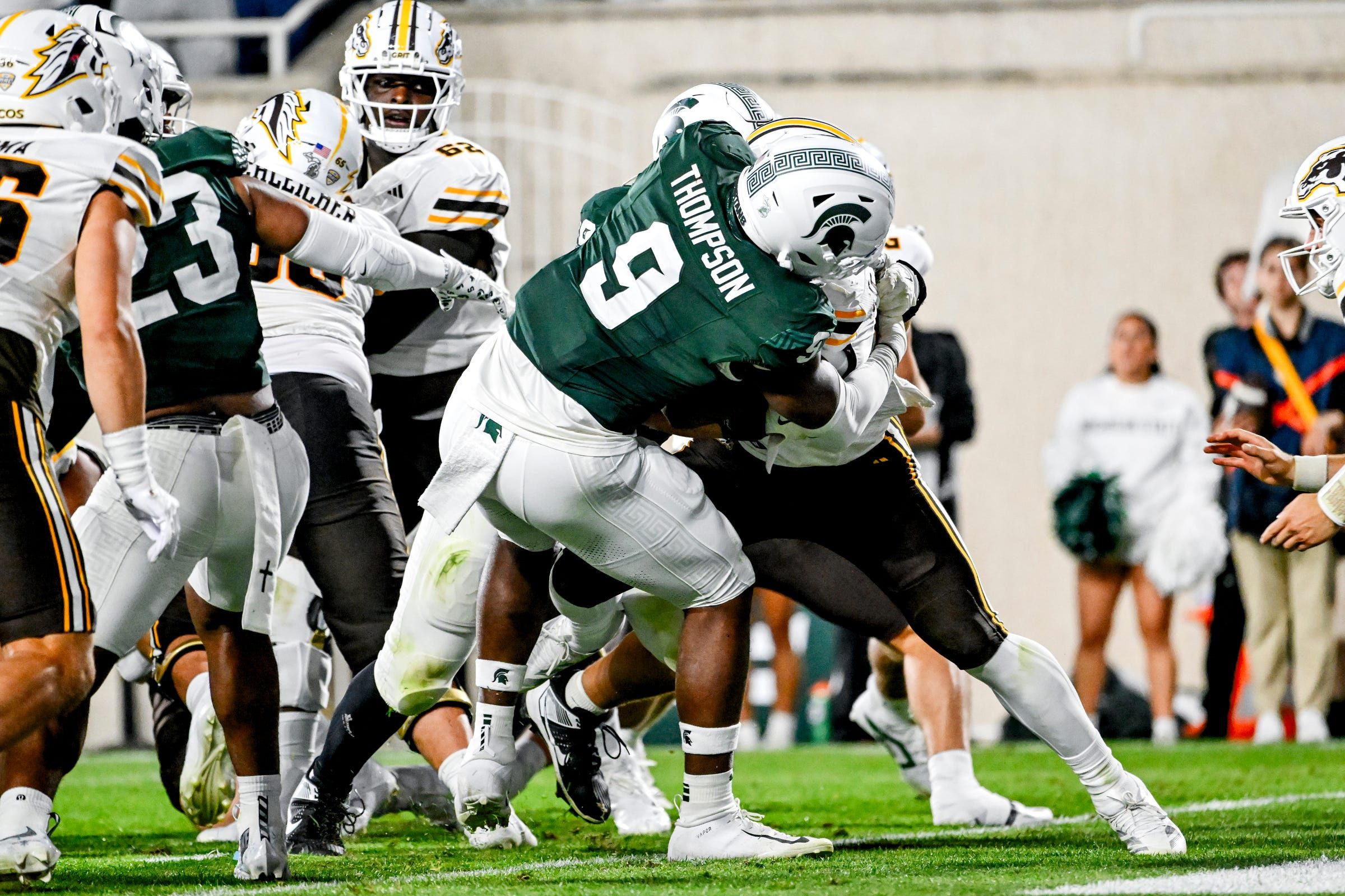 Michigan State's Jalen Thompson, left, tackles Western Michigan's Jalen Buckley for a safety during the third quarter on Friday, Aug. 29, 2025, in East Lansing.