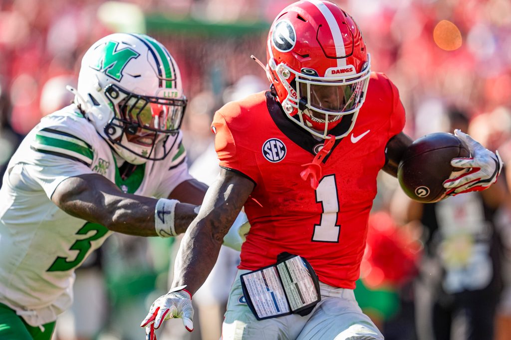 Aug 30, 2025; Athens, Georgia, USA; Georgia Bulldogs wide receiver Zachariah Branch (1) runs past Marshall Thundering Herd defensive back Marvae Myers (3) for a touchdown after catching a pass at Sanford Stadium. Mandatory Credit: Dale Zanine-Imagn Images