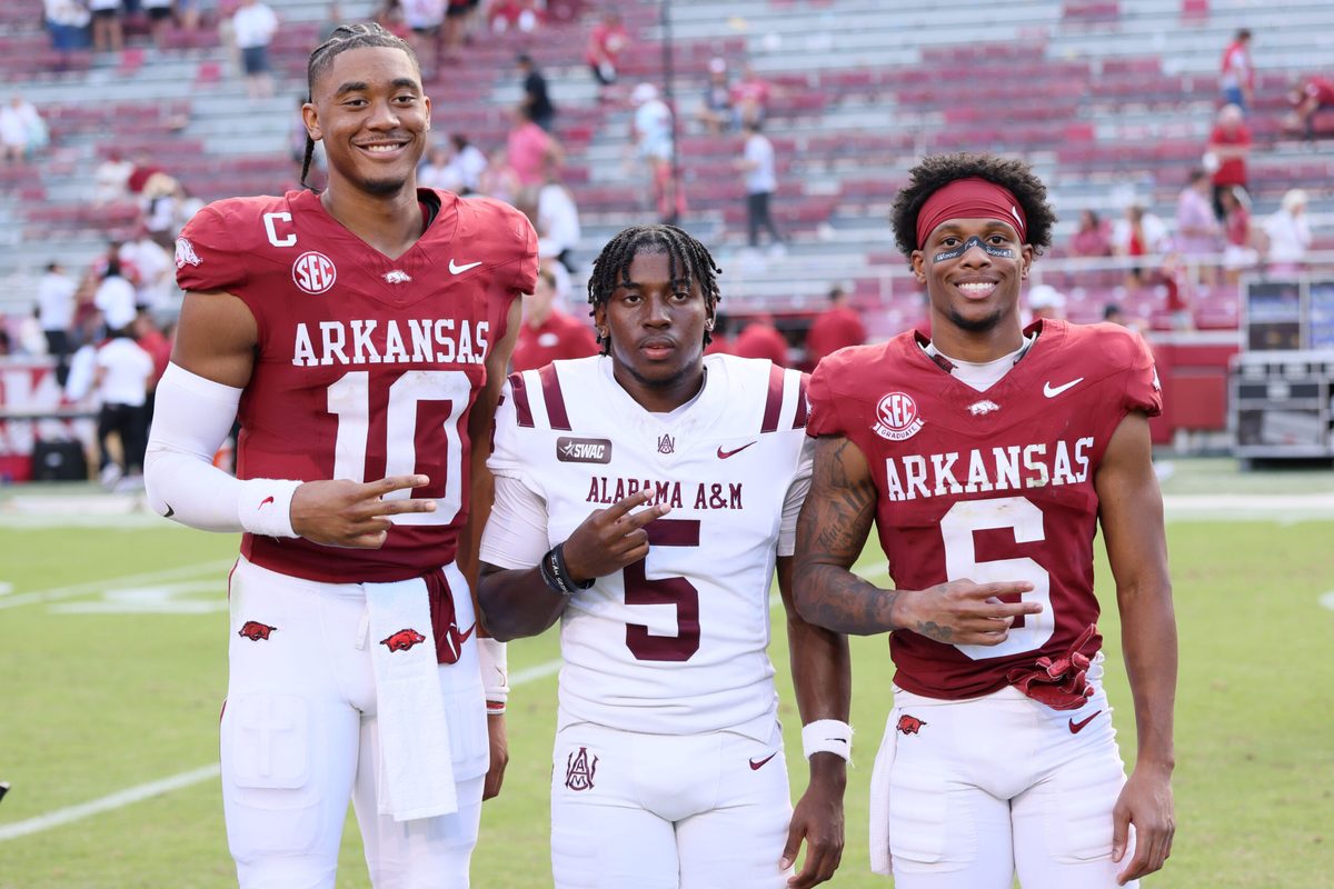 Aug 30, 2025; Fayetteville, Arkansas, USA; Arkansas Razorbacks quarterback Taylen Green (10) Alabama A&M Bulldogs wide receiver Myles Parker (5) and Razorbacks wide receiver Raylen Sharpe (6) pose for a photo after the game at Donald W. Reynolds Razorback Stadium. Mandatory Credit: Nelson Chenault-Imagn Images