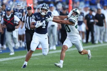 Aug 30, 2025; Provo, Utah, USA; Brigham Young Cougars running back LJ Martin (4) runs the ball against Portland State Vikings linebacker Lonnie Burt (40) during the second quarter at LaVell Edwards Stadium. Mandatory Credit: Rob Gray-Imagn Images
