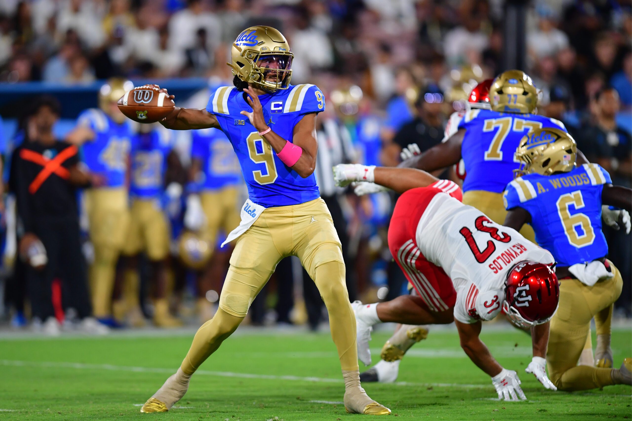 Aug 30, 2025; Pasadena, California, USA; UCLA Bruins quarterback Nico Iamaleava (9) throws against the against the Utah Utes during the first half at the Rose Bowl. Mandatory Credit: Gary A. Vasquez-Imagn Images