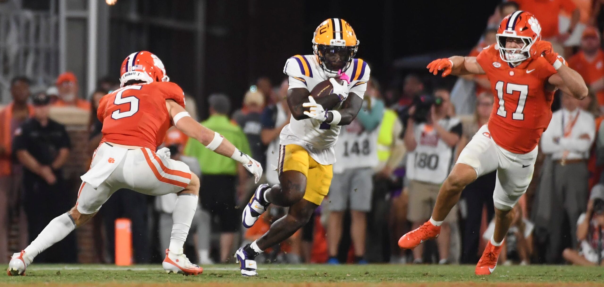 Clemson Tigers defensive back Ronan Hanafin (5) and Clemson Tigers linebacker Wade Woodaz (17) go to tackle LSU Tigers wide receiver Aaron Anderson (1) Saturday, Aug. 30, 2025 during the NCAA football game at Memorial Stadium in Clemson, South Carolina. LSU Tigers won 17-10.