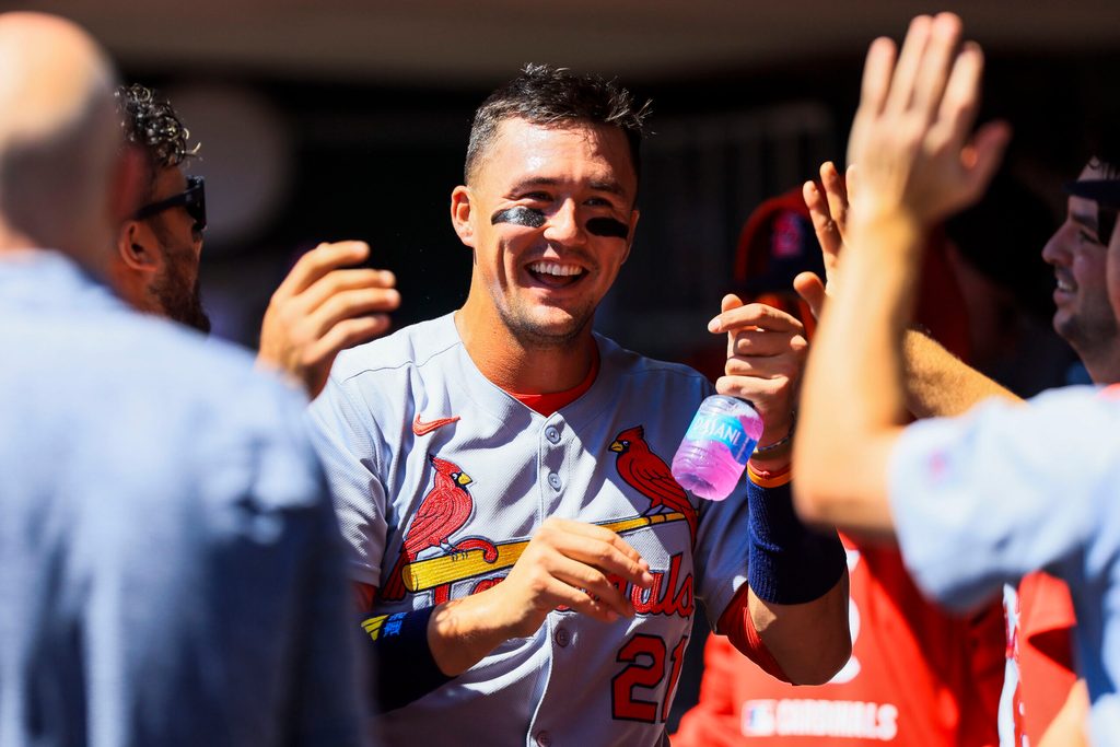 Aug 31, 2025; Cincinnati, Ohio, USA; St. Louis Cardinals outfielder Lars Nootbaar (21) high fives teammates after scoring on a sacrifice fly out hit by designated hitter Ivan Herrera (not pictured) in the third inning against the Cincinnati Reds at Great American Ball Park. Mandatory Credit: Katie Stratman-Imagn Images