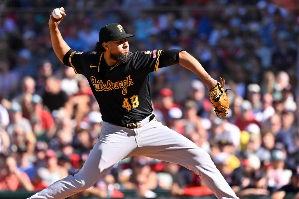 Aug 31, 2025; Boston, Massachusetts, USA; Pittsburgh Pirates relief pitcher Yohan Ramírez (49) pitches against the Boston Red Sox during the eighth inning at Fenway Park. Mandatory Credit: Eric Canha-Imagn Images