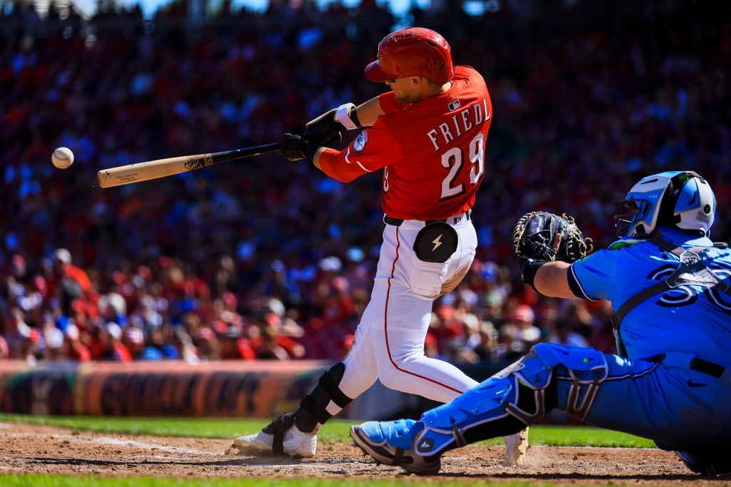 Sep 1, 2025; Cincinnati, Ohio, USA; Cincinnati Reds outfielder TJ Friedl (29) hits a RBI ground-rule double in the ninth inning against the Toronto Blue Jays at Great American Ball Park. Mandatory Credit: Katie Stratman-Imagn Images