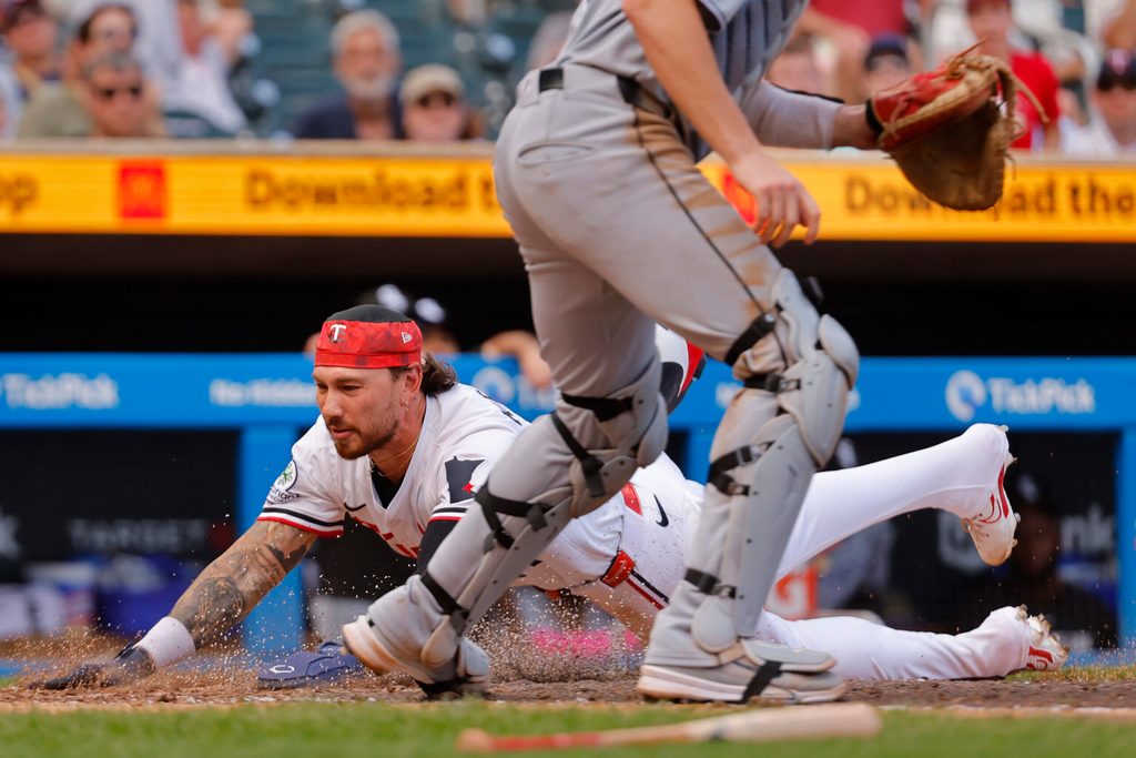 Sep 1, 2025; Minneapolis, Minnesota, USA; Minnesota Twins pinch runner DaShawn Keirsey (21) scores on a sacrifice fly against the Chicago White Sox in the sixth inning at Target Field. Mandatory Credit: Bruce Kluckhohn-Imagn Images