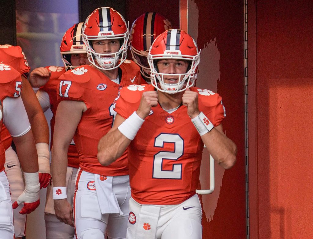 Clemson quarterback Cade Klubnik (2) and quarterback Christopher Vizzina (17) walk toward the field before the game with Clemson and Louisiana State University at Memorial Stadium in Clemson, S.C. Saturday, August 30, 2025.