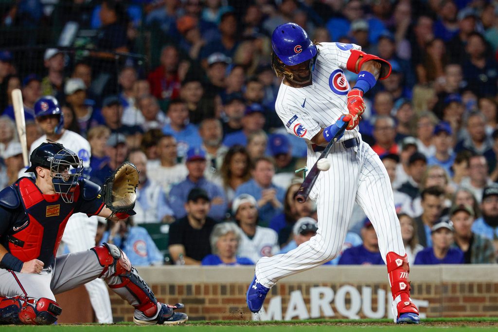 Sep 5, 2025; Chicago, Illinois, USA; Chicago Cubs center fielder Kevin Alcantara (13) singles against the Atlanta Braves during the third inning at Wrigley Field. Mandatory Credit: Kamil Krzaczynski-Imagn Images