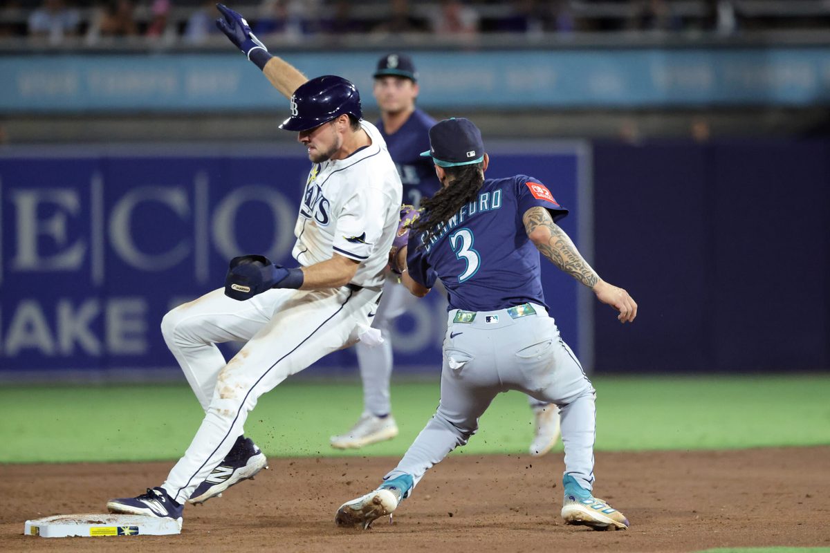 Sep 2, 2025; St. Petersburg, Florida, USA; Tampa Bay Rays outfielder Josh Lowe (15) steals second base as Seattle Mariners shortstop J.P. Crawford (3) attempted to tag him out during the third inning at George M. Steinbrenner Field. Mandatory Credit: Kim Klement Neitzel-Imagn Images