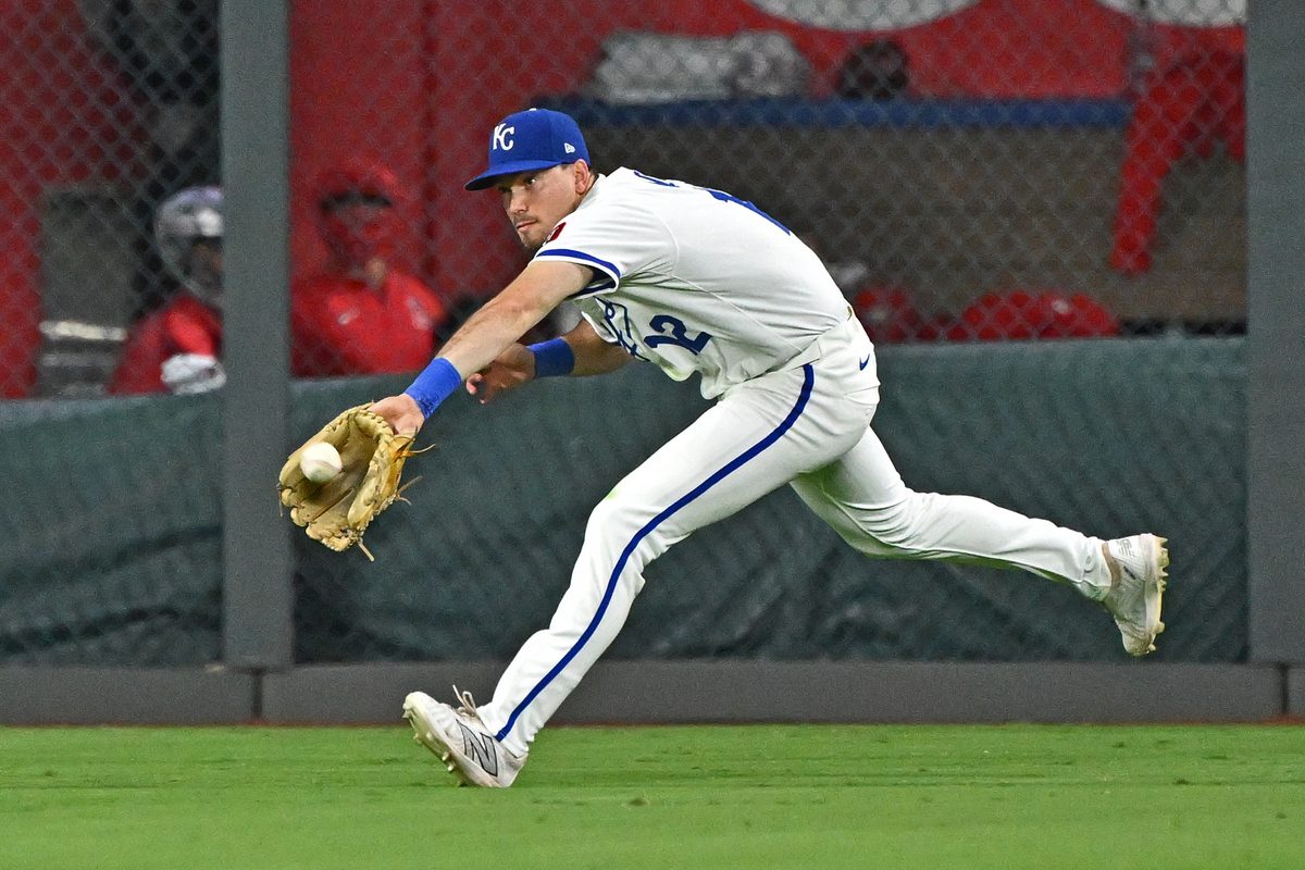 Sep 2, 2025; Kansas City, Missouri, USA; Kansas City Royals left fielder Nick Loftin (12) makes a running catch in the ninth inning against the Los Angeles Angels at Kauffman Stadium. Mandatory Credit: Peter Aiken-Imagn Images