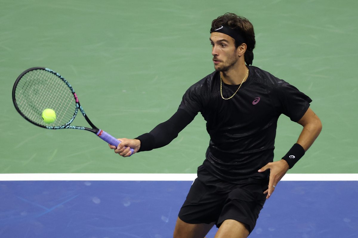Sep 3, 2025; Flushing, NY, USA; Lorenzo Musetti (ITA) hits a shot against Jannik Sinner (ITA) (not pictured) on day eleven of the 2025 US Open tennis championships at USTA Billie Jean King National Tennis Center. Mandatory Credit: Mike Frey-Imagn Images