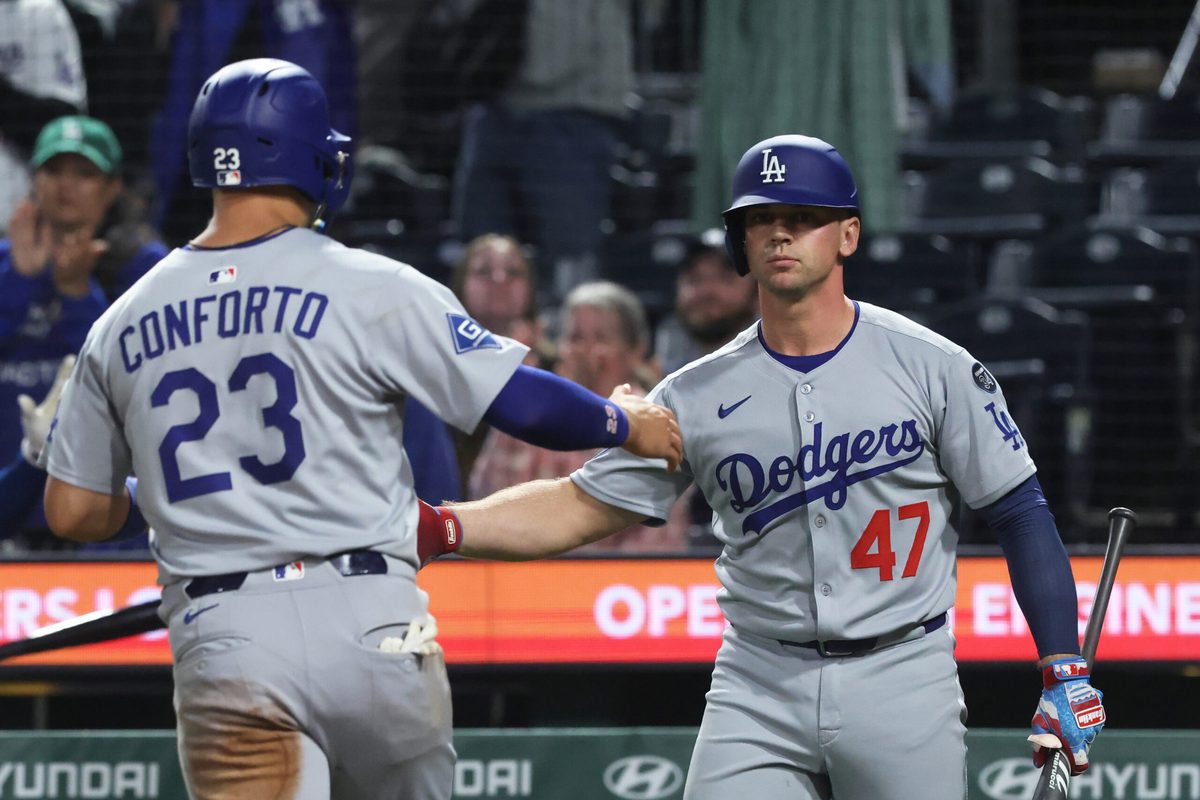 Sep 4, 2025; Pittsburgh, Pennsylvania, USA;  Los Angeles Dodgers catcher Ben Rortvedt (47) congratulates left fielder Michael Conforto (23) crossing home plate to score a run against the Pittsburgh Pirates at PNC Park. Mandatory Credit: Charles LeClaire-Imagn Images