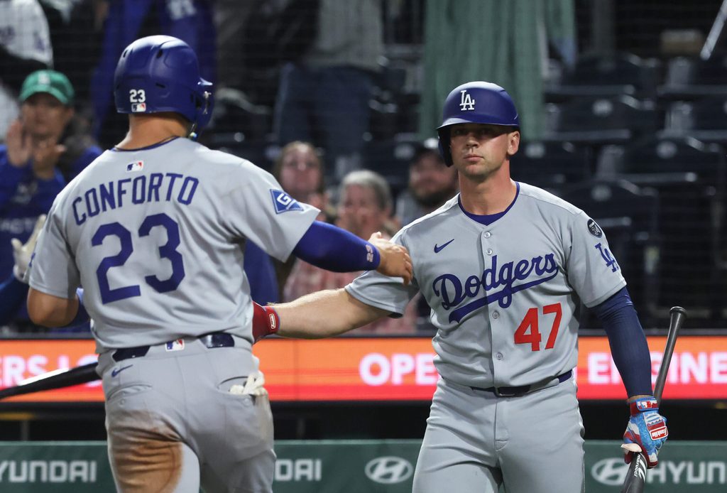 Sep 4, 2025; Pittsburgh, Pennsylvania, USA; Los Angeles Dodgers catcher Ben Rortvedt (47) congratulates left fielder Michael Conforto (23) crossing home plate to score a run against the Pittsburgh Pirates at PNC Park. Mandatory Credit: Charles LeClaire-Imagn Images