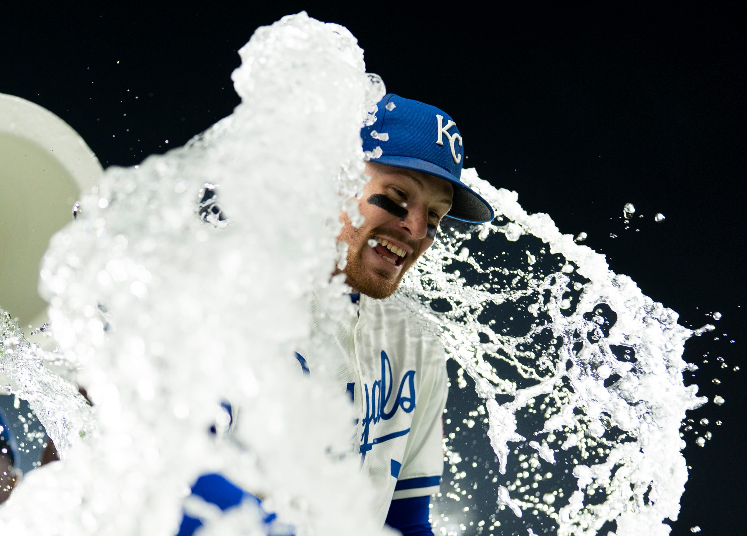 Sep 4, 2025; Kansas City, Missouri, USA; Kansas City Royals shortstop Bobby Witt Jr. (7) is doused by center fielder Kyle Isbel (28) and second baseman Tyler Tolbert (2) after defeating the Los Angeles Angels at Kauffman Stadium. Mandatory Credit: Jay Biggerstaff-Imagn Images