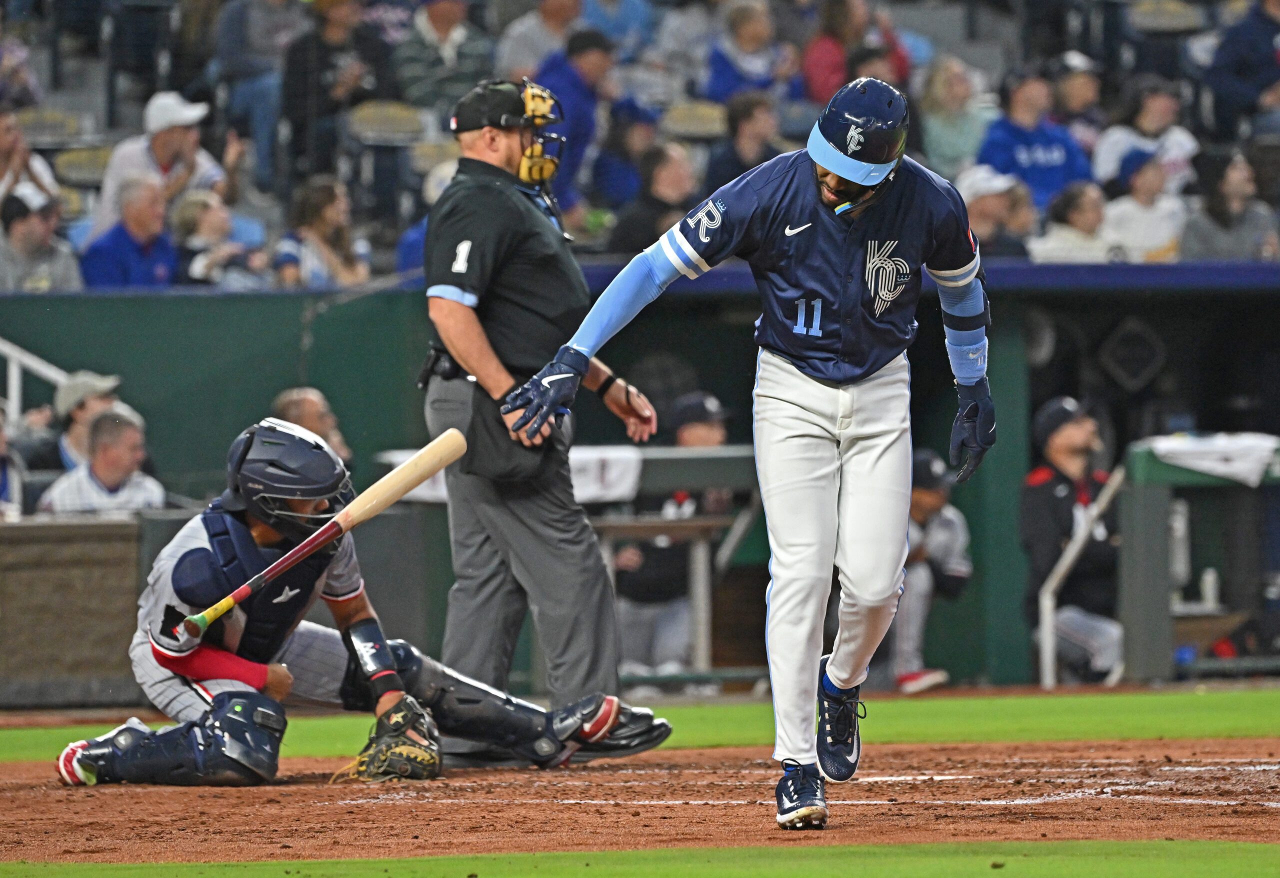 Sep 5, 2025; Kansas City, Missouri, USA; Kansas City Royals third baseman Maikel Garcia (11) throws his bat to the ground after hitting a two-run home run in the third inning against the Minnesota Twins at Kauffman Stadium. Mandatory Credit: Peter Aiken-Imagn Images