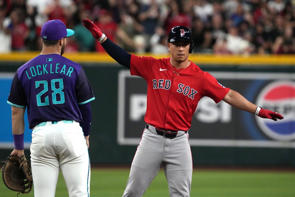 Sep 5, 2025; Phoenix, Arizona, USA; Boston Red Sox outfielder Rob Refsnyder (30) reacts after hitting an RBI double against the Arizona Diamondbacks in the eighth inning at Chase Field. Mandatory Credit: Rick Scuteri-Imagn Images