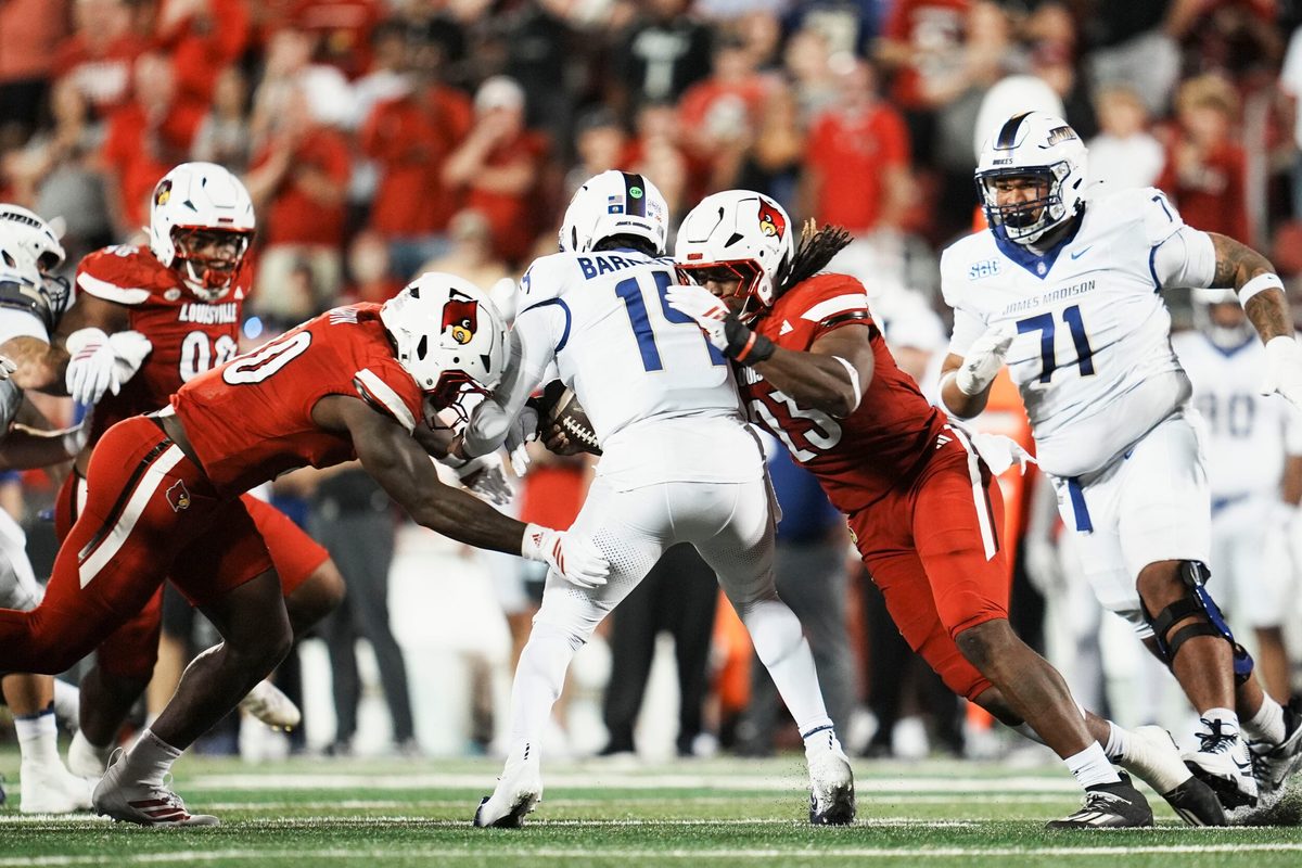 Louisville Cardinals defensive lineman Clev Lubin (50) and Louisville Cardinals defensive lineman Wesley Bailey (23) sack DUPLICATE***James Madison Dukes quarterback Alonza Barnett III (14) in the first half during the Louisville-James Madison college football game Friday September 5, 2025 at L&N Credit Union Stadium in Louisville, Kentucky.