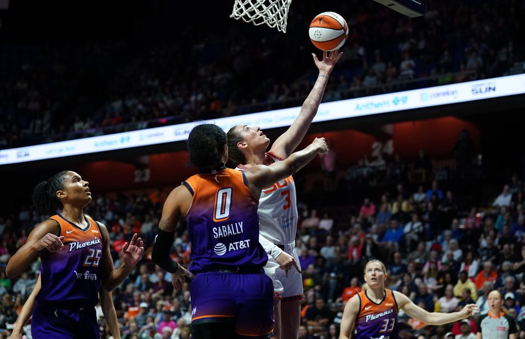 Sep 6, 2025; Uncasville, Connecticut, USA; Connecticut Sun guard Marina Mabrey (3) scores against Phoenix Mercury forward Satou Sabally (0) in the first half at Mohegan Sun Arena. Mandatory Credit: David Butler II-Imagn Images