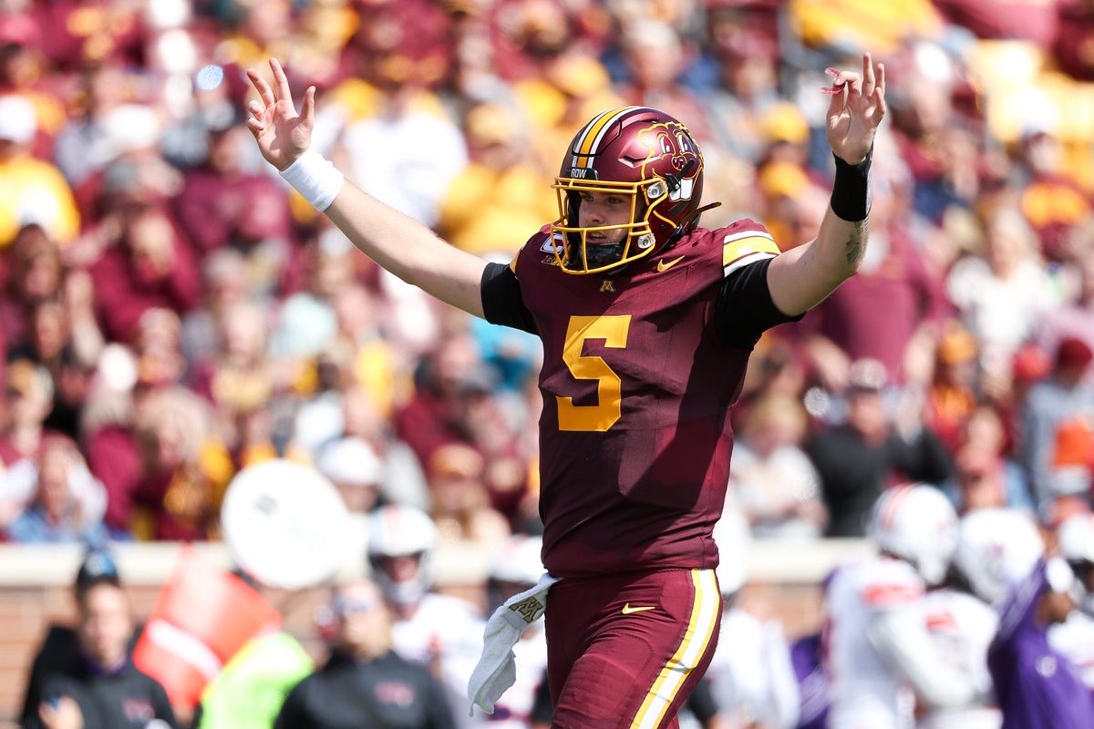 Sep 6, 2025; Minneapolis, Minnesota, USA; Minnesota Golden Gophers quarterback Drake Lindsey (5) celebrates running back Cam Davis's (23) touchdown against the Northwestern State Demons during the second quarter at Huntington Bank Stadium. Mandatory Credit: Matt Krohn-Imagn Images