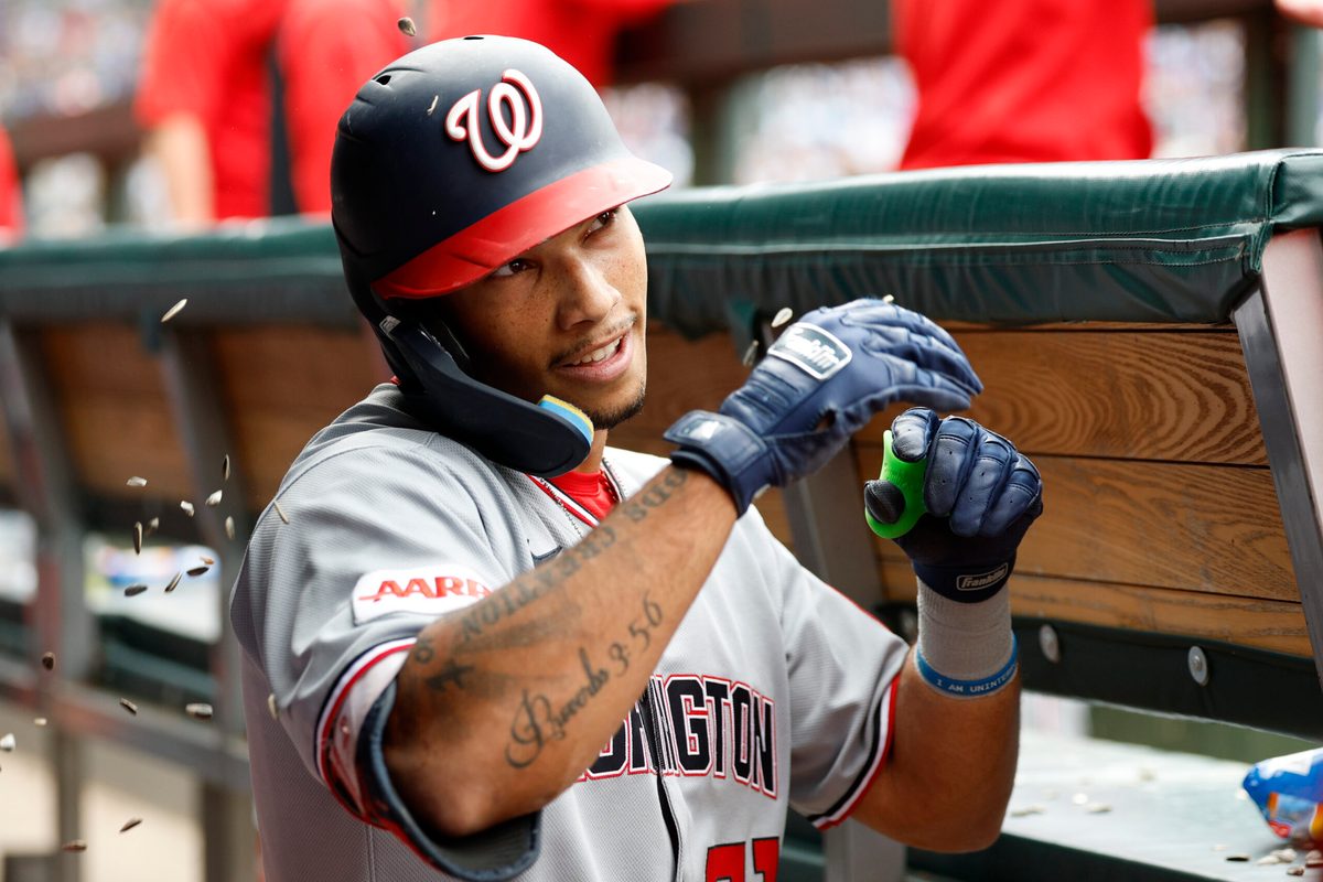 Sep 6, 2025; Chicago, Illinois, USA; Washington Nationals left fielder Daylen Lile (51) celebrates with teammates in the dugout after hitting a solo home run against the Chicago Cubs during the fourth inning at Wrigley Field. Mandatory Credit: Kamil Krzaczynski-Imagn Images