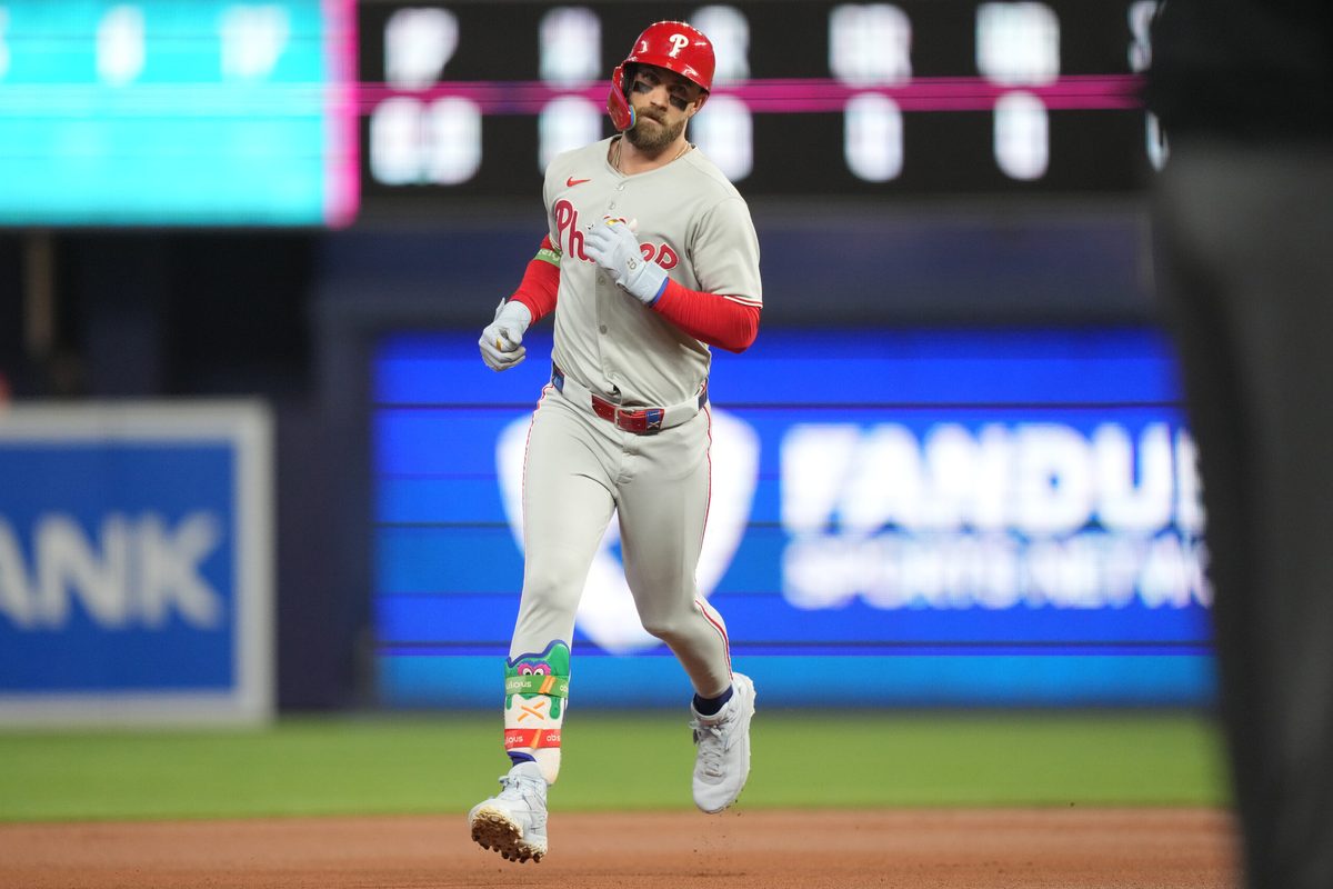 Sep 6, 2025; Miami, Florida, USA; Philadelphia Phillies first baseman Bryce Harper (3) hits a two-run home run in the first inning against the Miami Marlins at loanDepot Park. Mandatory Credit: Jim Rassol-Imagn Images