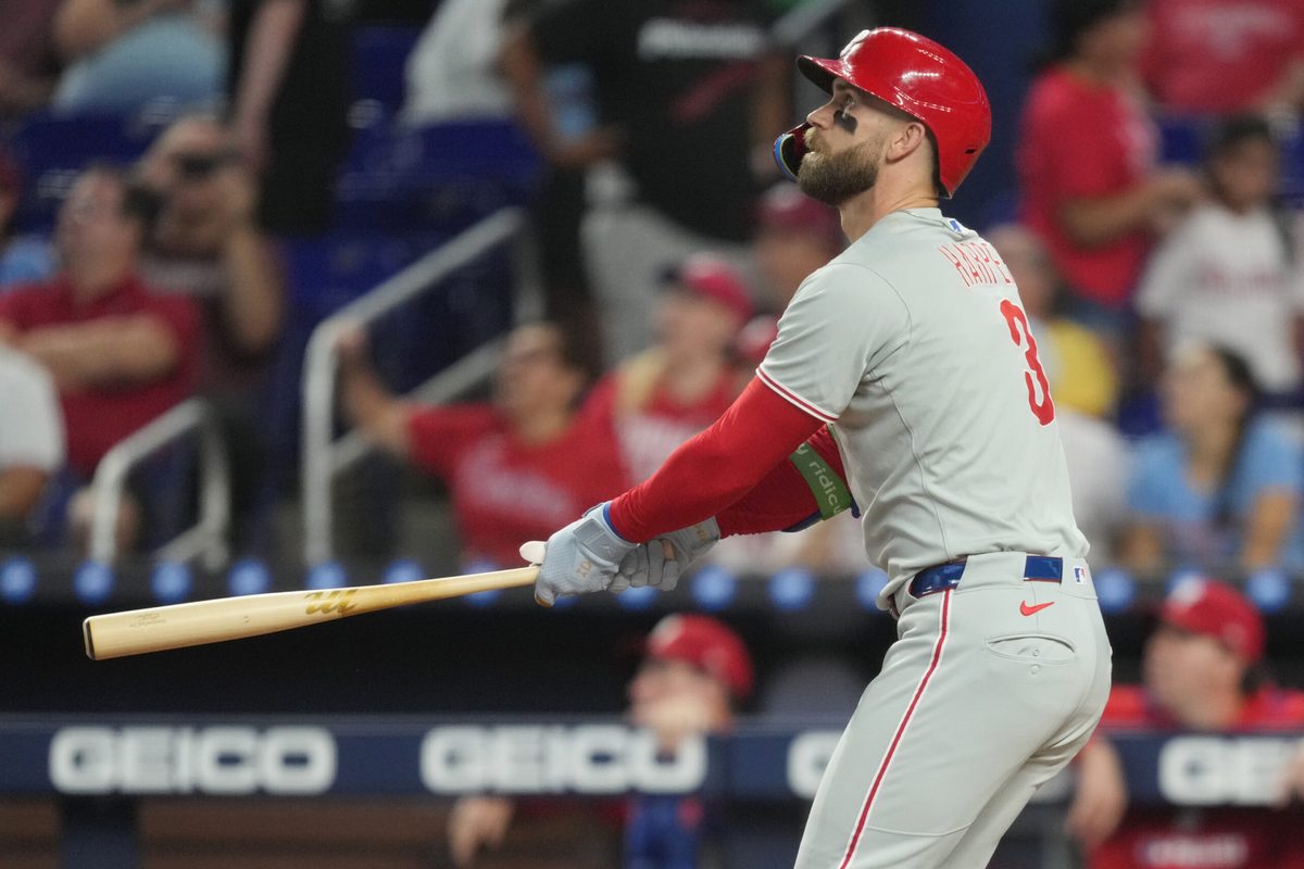 Sep 6, 2025; Miami, Florida, USA; Philadelphia Phillies first baseman Bryce Harper (3) hits a two-run home run in the first inning against the Miami Marlins at loanDepot Park. Mandatory Credit: Jim Rassol-Imagn Images