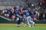 Sep 6, 2025; Cumberland, Georgia, USA; Seattle Mariners catcher Cal Raleigh (29), first base Josh Naylor (12), second base Leo Rivas (76), and shortstop J.P. Crawford (3) celebrate a victory against the Atlanta Braves after the game at Truist Park. Mandatory Credit: Jordan Godfree-Imagn Images