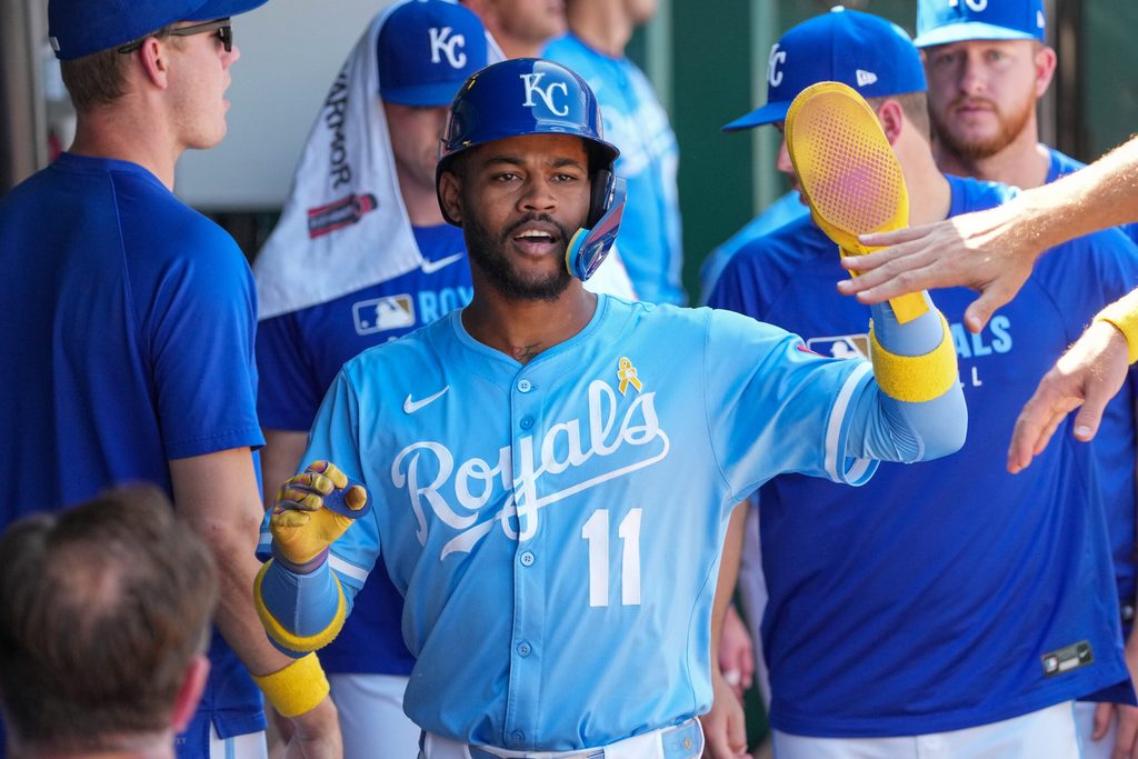 Sep 7, 2025; Kansas City, Missouri, USA; Kansas City Royals shortstop Maikel Garcia (11) celebrates in the dugout after scoring against the Minnesota Twins in the sixth inning at Kauffman Stadium. Mandatory Credit: Denny Medley-Imagn Images