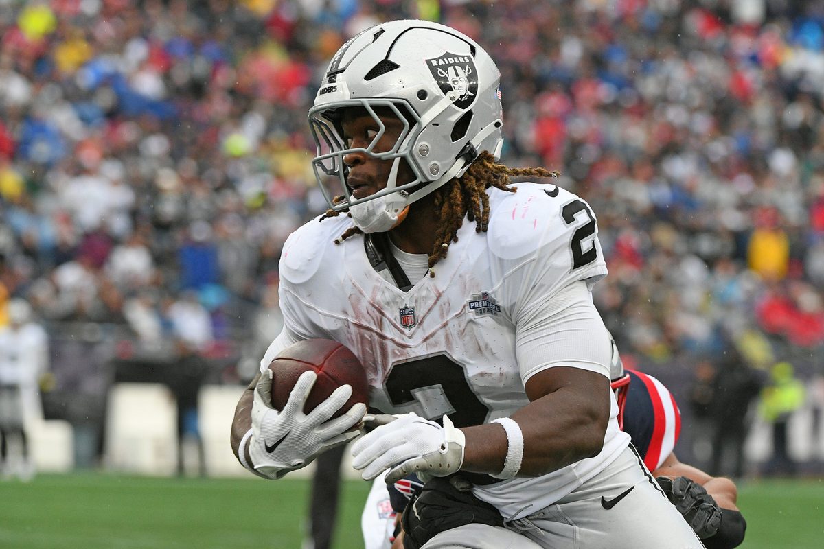 Sep 7, 2025; Foxborough, Massachusetts, USA; Las Vegas Raiders running back Ashton Jeanty (2) rushes the ball against the New England Patriots during the second half at Gillette Stadium. Mandatory Credit: Bob DeChiara-Imagn Images