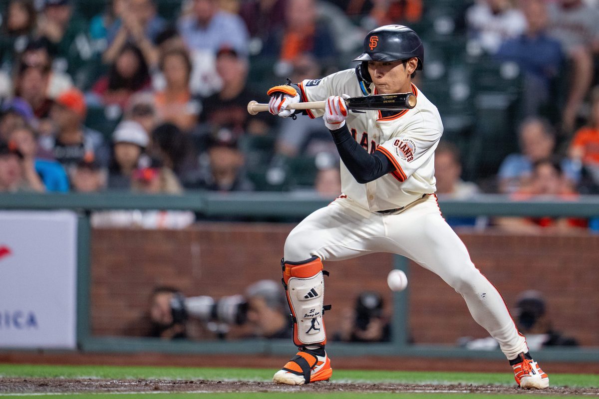 Sep 8, 2025; San Francisco, California, USA; San Francisco Giants center fielder Jung Hoo Lee (51) bunt hits to load the bases against the Arizona Diamondbacks during the sixth inning at Oracle Park. Mandatory Credit: Neville E. Guard-Imagn Images