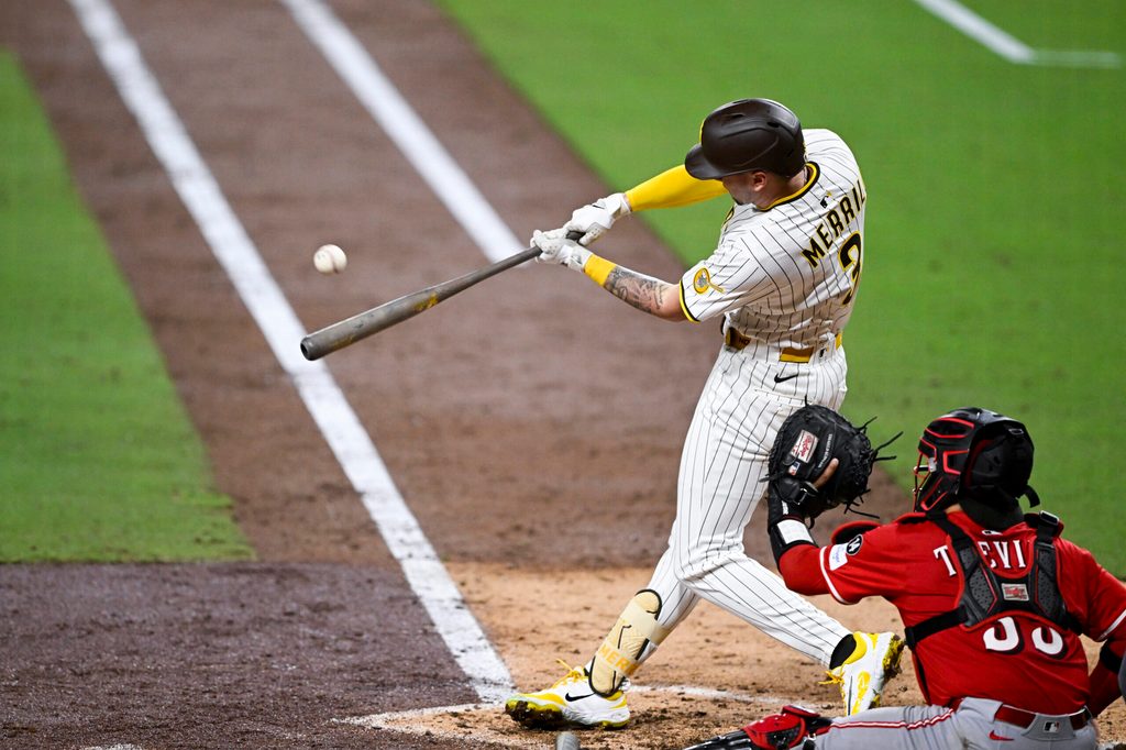 Sep 8, 2025; San Diego, California, USA; San Diego Padres center fielder Jackson Merrill (3) hits an RBI triple during the sixth inning against the Cincinnati Reds at Petco Park. Mandatory Credit: Denis Poroy-Imagn Images
