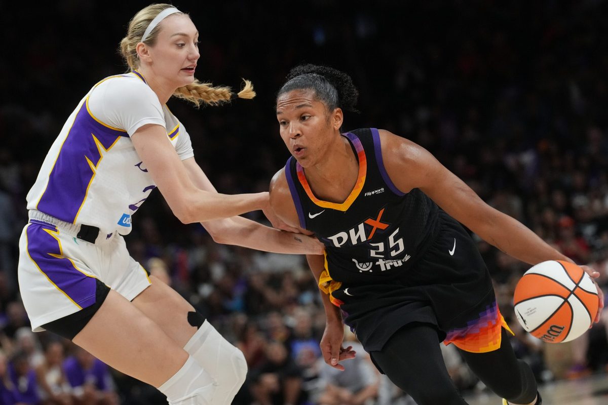 Phoenix Mercury forward Alyssa Thomas (25) drives past Los Angeles Sparks forward Cameron Brink (22) at PHX Arena on Sept. 9, 2025.