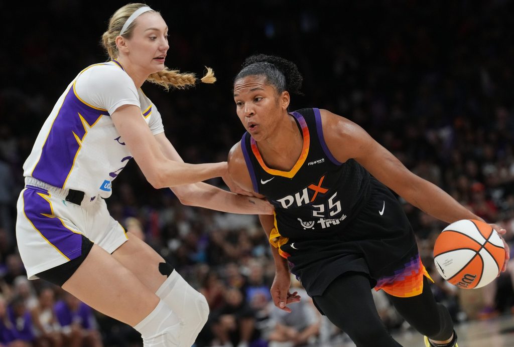 Phoenix Mercury forward Alyssa Thomas (25) drives past Los Angeles Sparks forward Cameron Brink (22) at PHX Arena on Sept. 9, 2025.