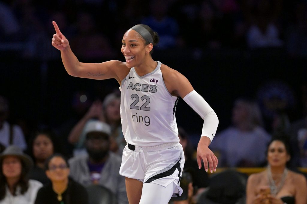 Sep 11, 2025; Los Angeles, California, USA; Las Vegas Aces center A'ja Wilson (22) celebrates after a 3 pointer  during the second half against the Los Angeles Sparks at Crypto.com Arena. Mandatory Credit: Jayne Kamin-Oncea-Imagn Images
