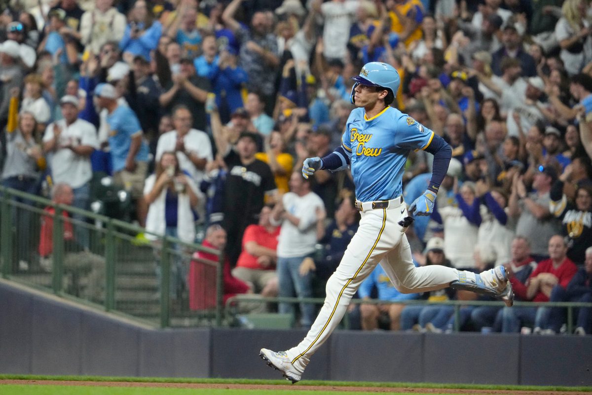 Sep 12, 2025; Milwaukee, Wisconsin, USA; Milwaukee Brewers outfielder Christian Yelich (22) hits a home run against the St. Louis Cardinals in the seventh inning at American Family Field. Mandatory Credit: Michael McLoone-Imagn Images