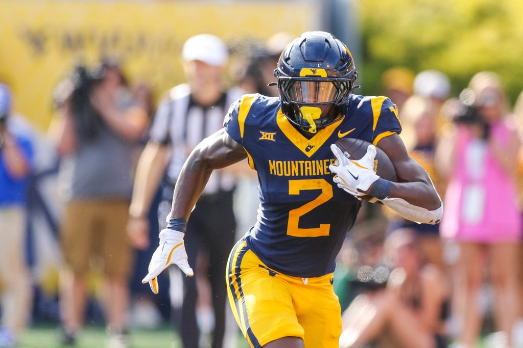 Sep 13, 2025; Morgantown, West Virginia, USA; West Virginia Mountaineers running back Tye Edwards (2) runs the ball during the second quarter against the Pittsburgh Panthers at Milan Puskar Stadium. Mandatory Credit: Ben Queen-Imagn Images
