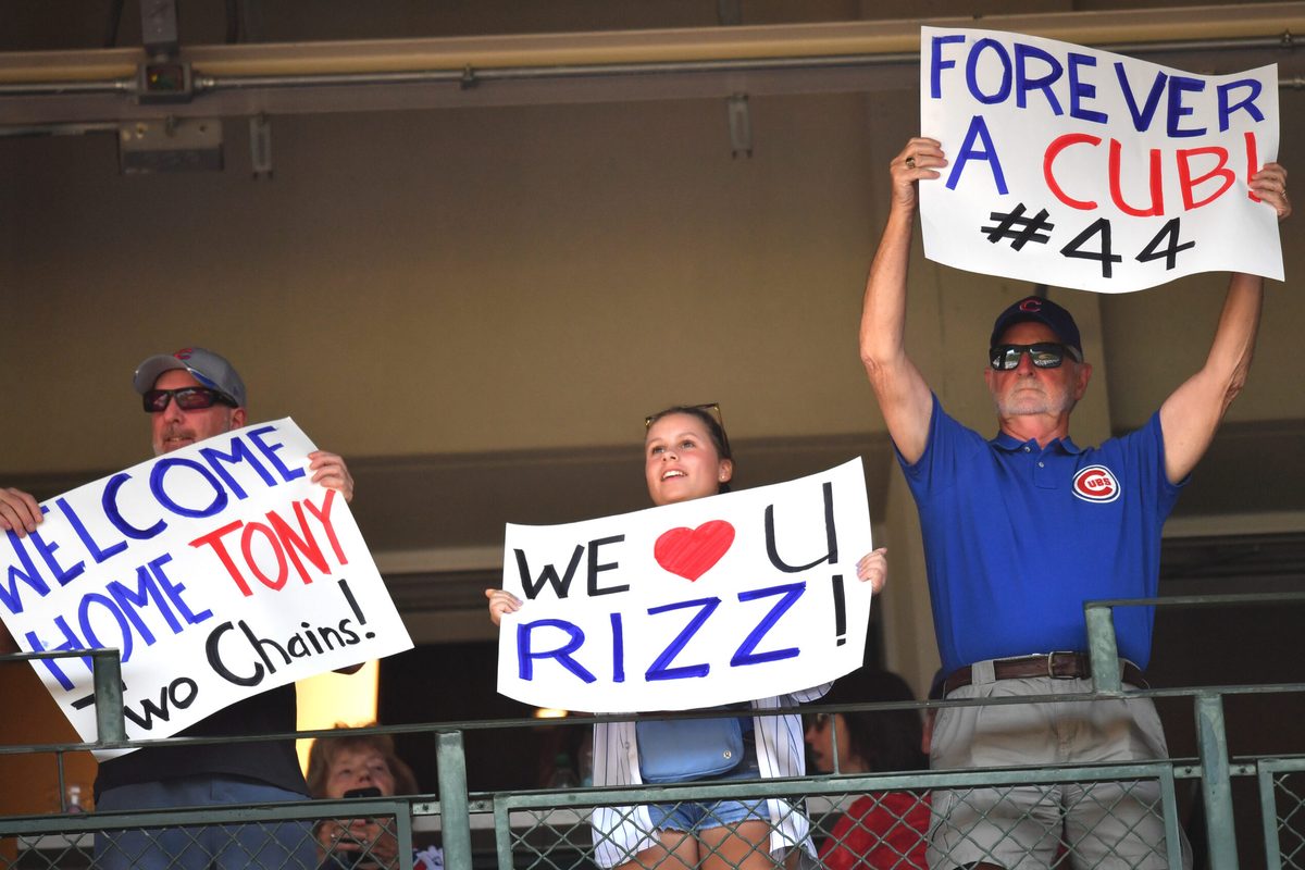 Sep 13, 2025; Chicago, Illinois, USA; Fans hold up signs for former Chicago Cubs player Anthony Rizzo during a game against the Tampa Bay Rays at Wrigley Field. Mandatory Credit: Patrick Gorski-Imagn Images