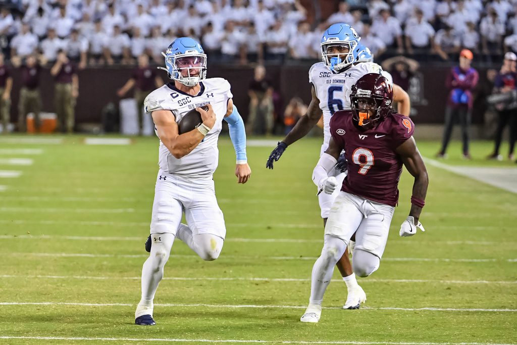 Sep 13, 2025; Blacksburg, Virginia, USA; Old Dominion Monarchs quarterback Colton Joseph (1) runs the ball as Virginia Tech Hokies cornerback Isaiah Brown-Murray (9) pursues during the third quarter at Lane Stadium. Mandatory Credit: Brian Bishop-Imagn Images