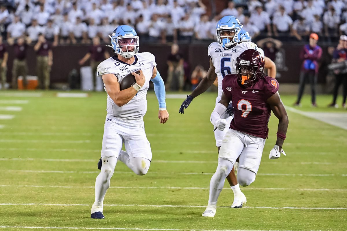 Sep 13, 2025; Blacksburg, Virginia, USA; Old Dominion Monarchs quarterback Colton Joseph (1) runs the ball as Virginia Tech Hokies cornerback Isaiah Brown-Murray (9) pursues during the third quarter at Lane Stadium. Mandatory Credit: Brian Bishop-Imagn Images
