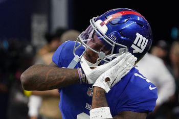 Sep 14, 2025; Arlington, Texas, USA; New York Giants wide receiver Malik Nabers (1) reacts after scoring a touchdown during the fourth quarter at AT&T Stadium. Mandatory Credit: Raymond Carlin III-Imagn Images