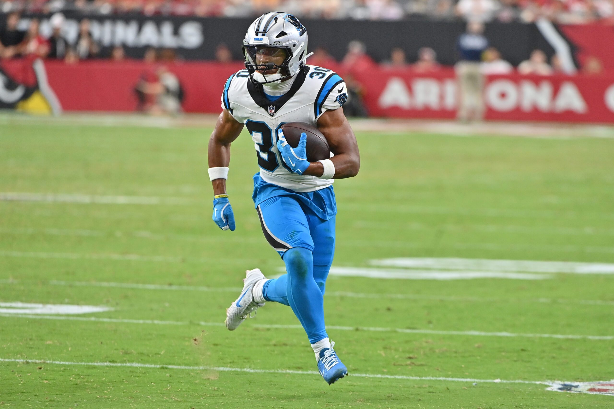 Sep 14, 2025; Glendale, Arizona, USA;  Carolina Panthers running back Chuba Hubbard (30) runs with the ball during the fourth quarter against the Arizona Cardinals at State Farm Stadium. Mandatory Credit: Matt Kartozian-Imagn Images